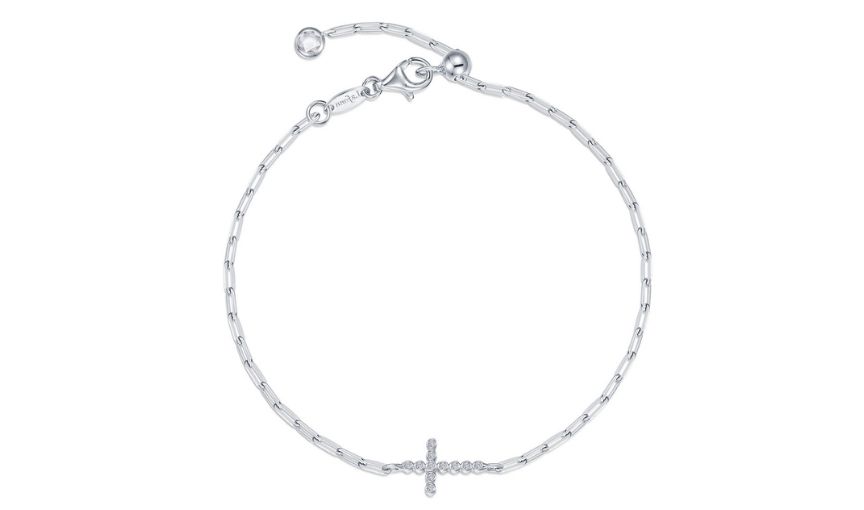 Silver chain bracelet with cross charm.