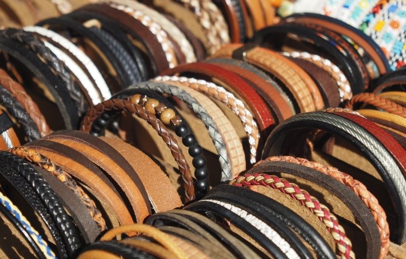 Assorted leather and beaded bracelets display.