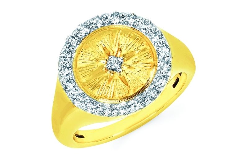 Gold ring with diamond halo.