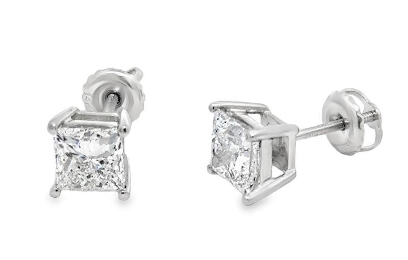 Princess-cut diamond stud earrings.
