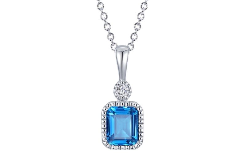 Blue topaz pendant with diamonds.