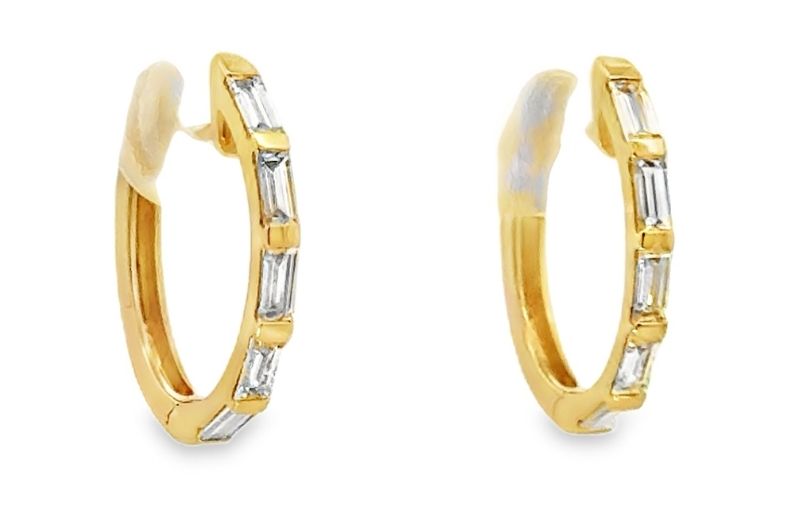 Gold hoop earrings with baguette diamonds.