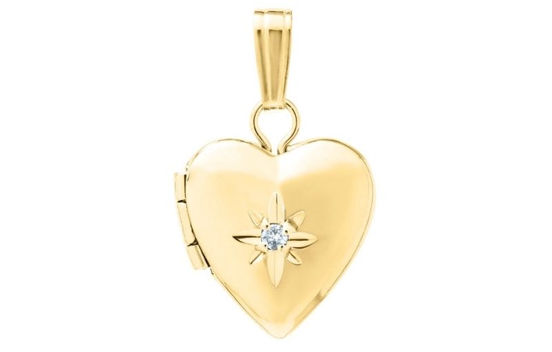 Gold heart locket with diamond.