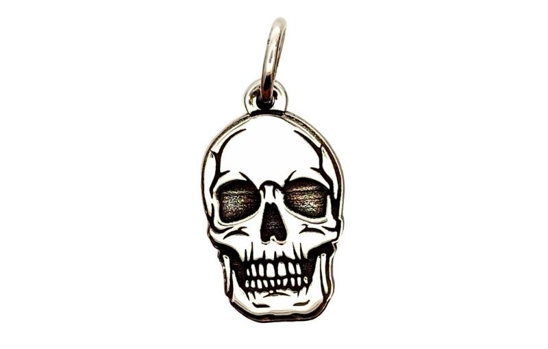 Silver skull charm pendant.
