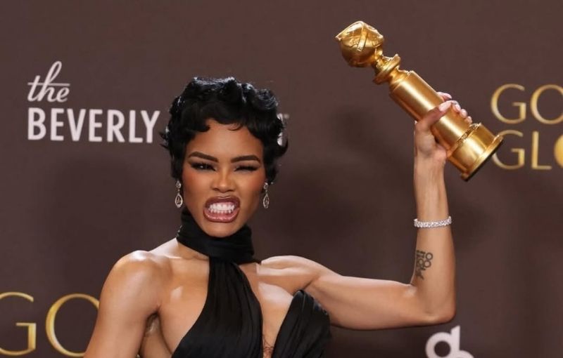 Teyana Taylor holding Golden Globe trophy.