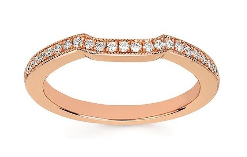 Rose gold band with diamond accents.