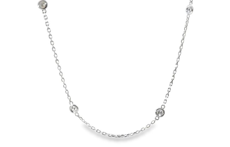 Bezel set diamond station chain necklace.