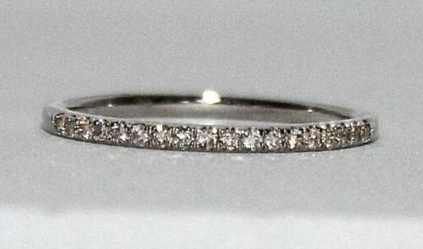 White gold band with diamond setting.