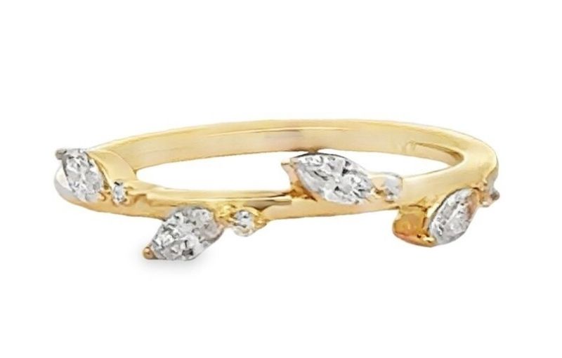 Yellow gold ring with diamond accents.