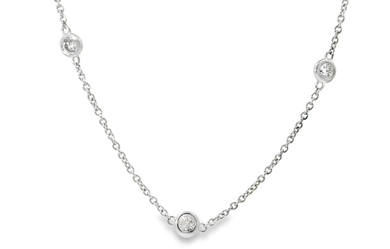 Diamond station necklace in white gold.