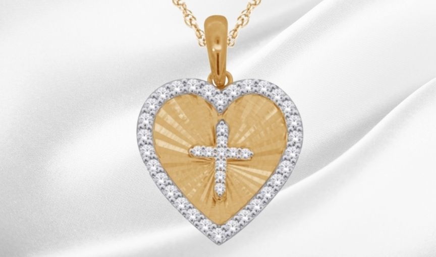 Heart-shaped pendant with diamond cross.