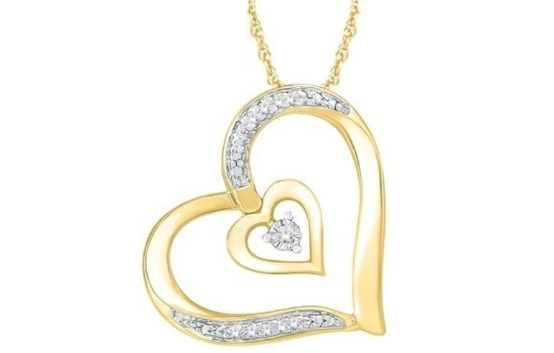 Double heart gold diamond pendant.