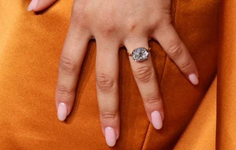 Zendaya wearing oval diamond engagement ring.