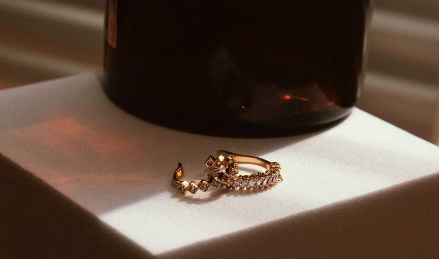 Elegant diamond rings on display with warm lighting setup