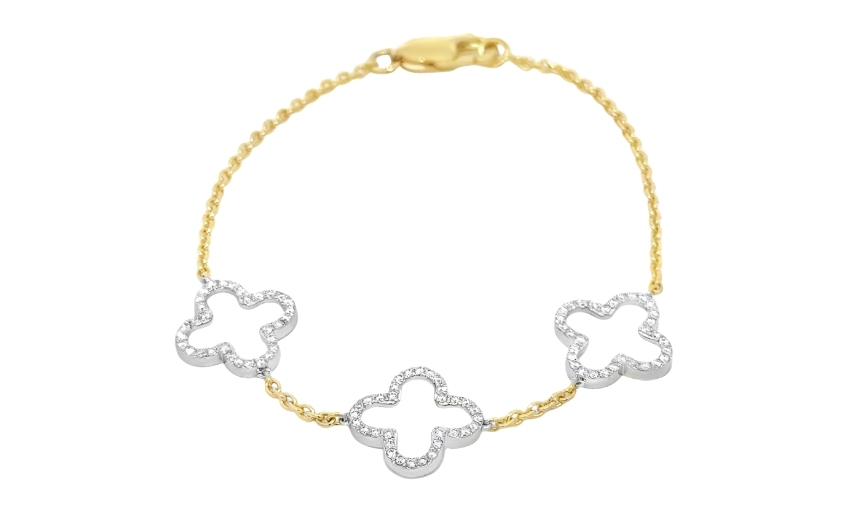Gold chain bracelet with diamond clover motif charms