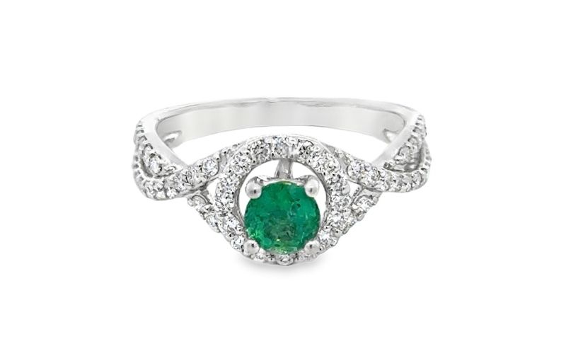 Emerald center diamond halo ring