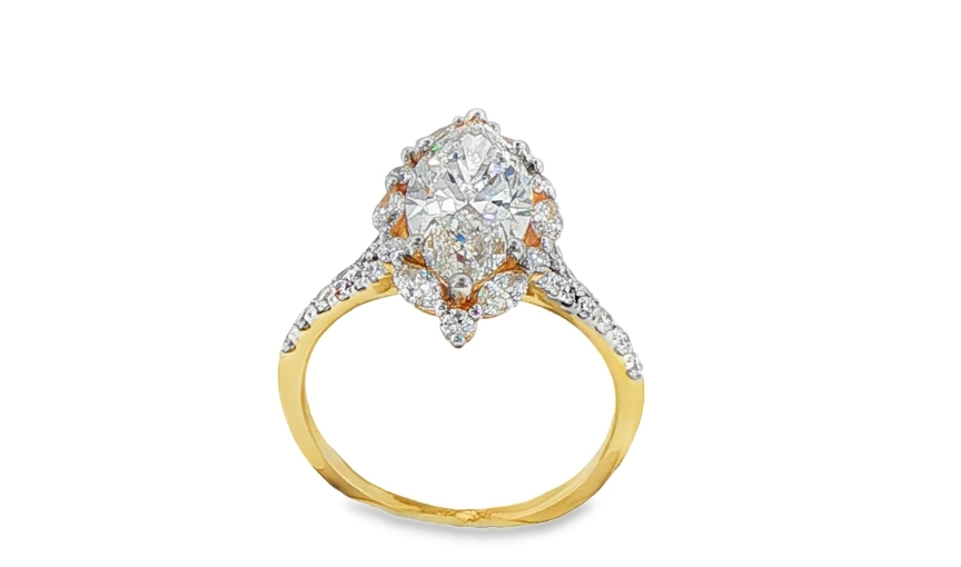 Oval halo diamond engagement ring in yellow gold