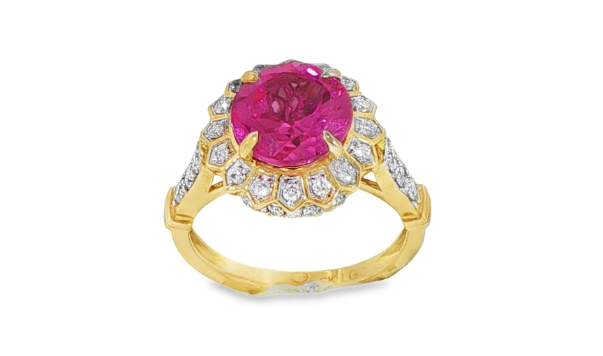 Pink gemstone halo ring in yellow gold setting