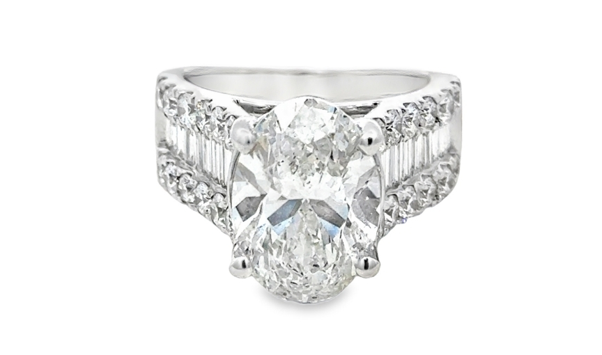 Oval diamond engagement ring with white gold band