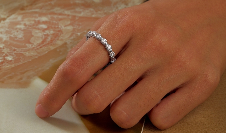 Diamond eternity band on hand close up luxury ring