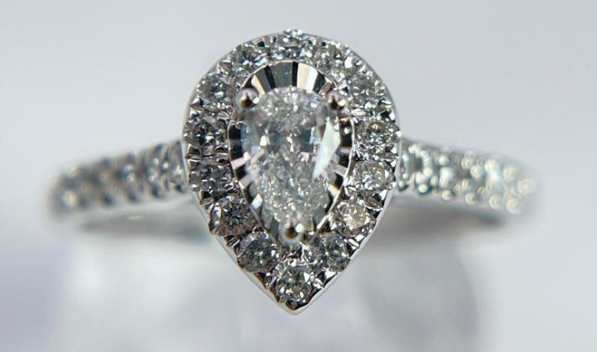 Pear halo diamond engagement ring in white gold