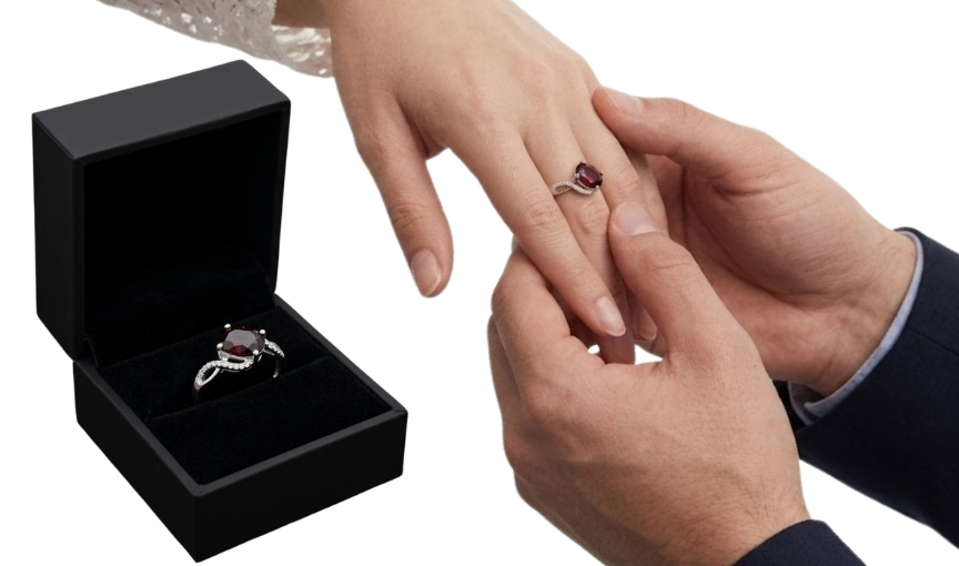 Oval garnet engagement ring during proposal
