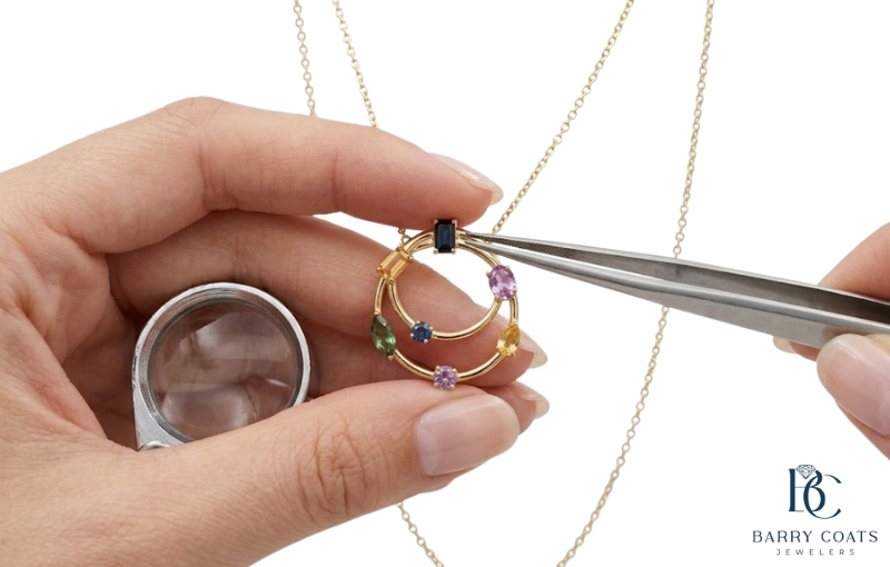 Inspecting a colorful gemstone pendant necklace Diamond pavé wedding band on bride's hand