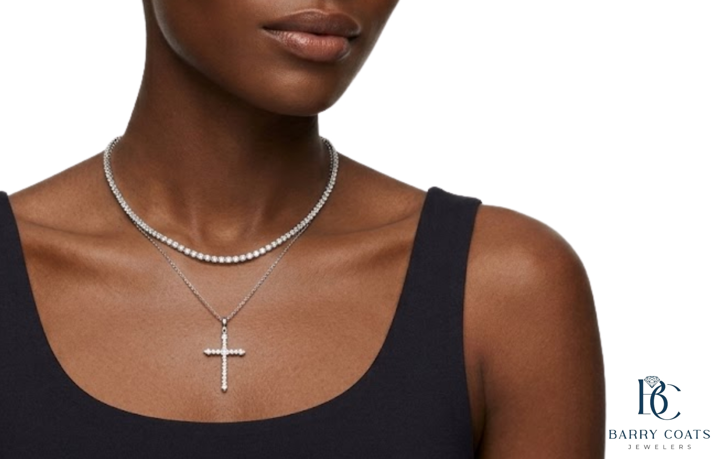 Layered diamond cross necklace in white gold Diamond pavé wedding band on bride's hand