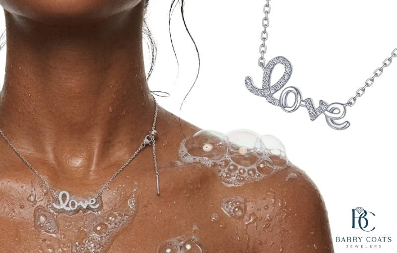 Silver love necklace worn during daily activities White gold diamond pavé eternity ring close-up