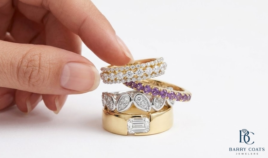 Hand stacking multiple luxury gemstone rings