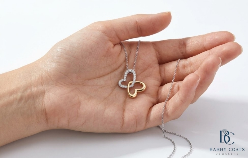 Why Diamond Necklaces Make Enduring Love Symbols Image Diamond pavé wedding band on bride's hand